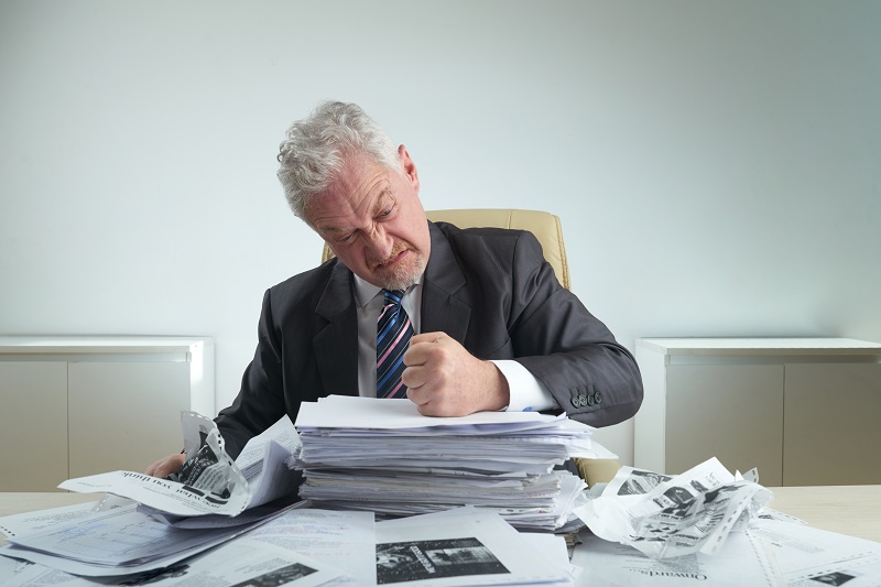 Furious Entrepreneur Crumpling Documents